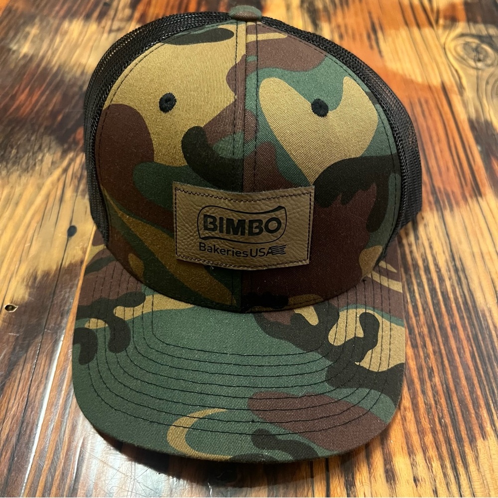 Bimbo Bakeries Camouflage Trucker style hat. Adjustable.